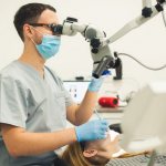 conservative treatment of cysts under a microscope