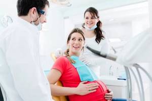Почему крошатся зубы при беременности?